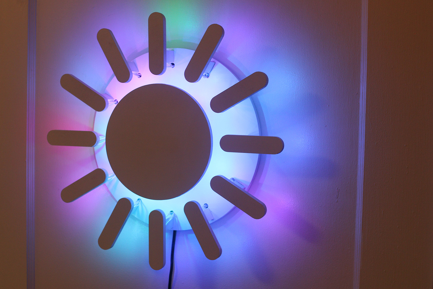 The Sun Clock in party mode is backlight with rainbow colors.